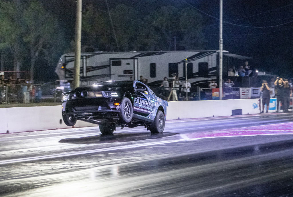 race-inspection-car-wheelie